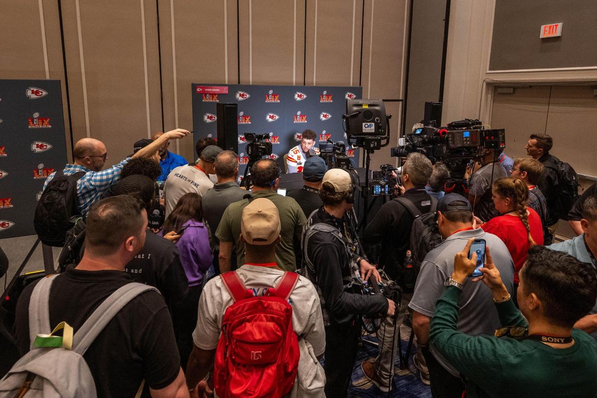 Kansas City Chiefs quarterback Patrick Mahomes is swarmed by reporters in New Orleans on Thursday, Feb. 6, 2025. Mahomes is looking to lead the Chiefs to their third straight championship, a first for any team in the Super Bowl era.