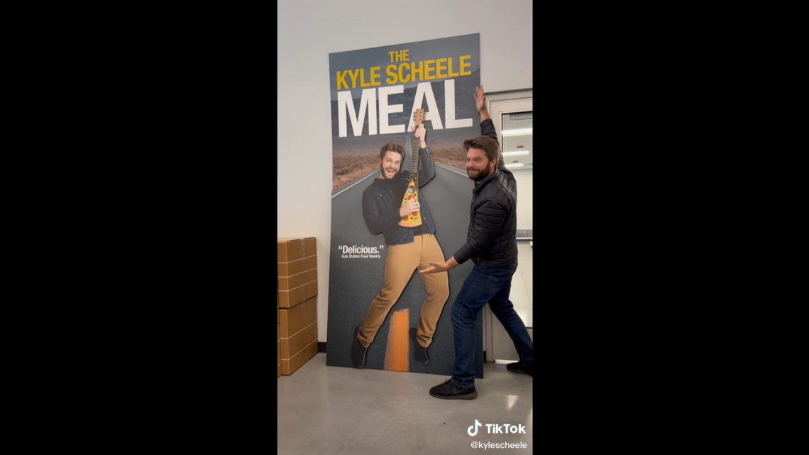 Kyle Scheele with his cutout that was later placed in a Kum & Go gas station convenience store as part of a marketing campaign.