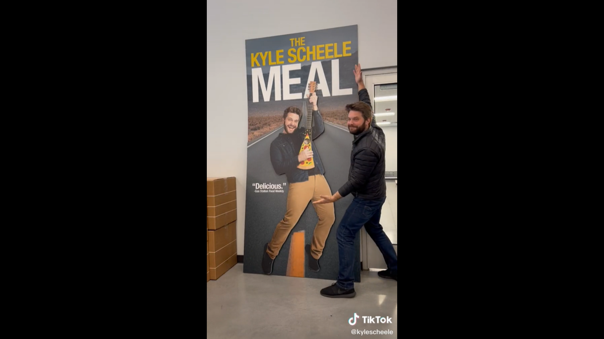 Kyle Scheele with his cutout that was later placed in a Kum & Go gas station convenience store as part of a marketing campaign.