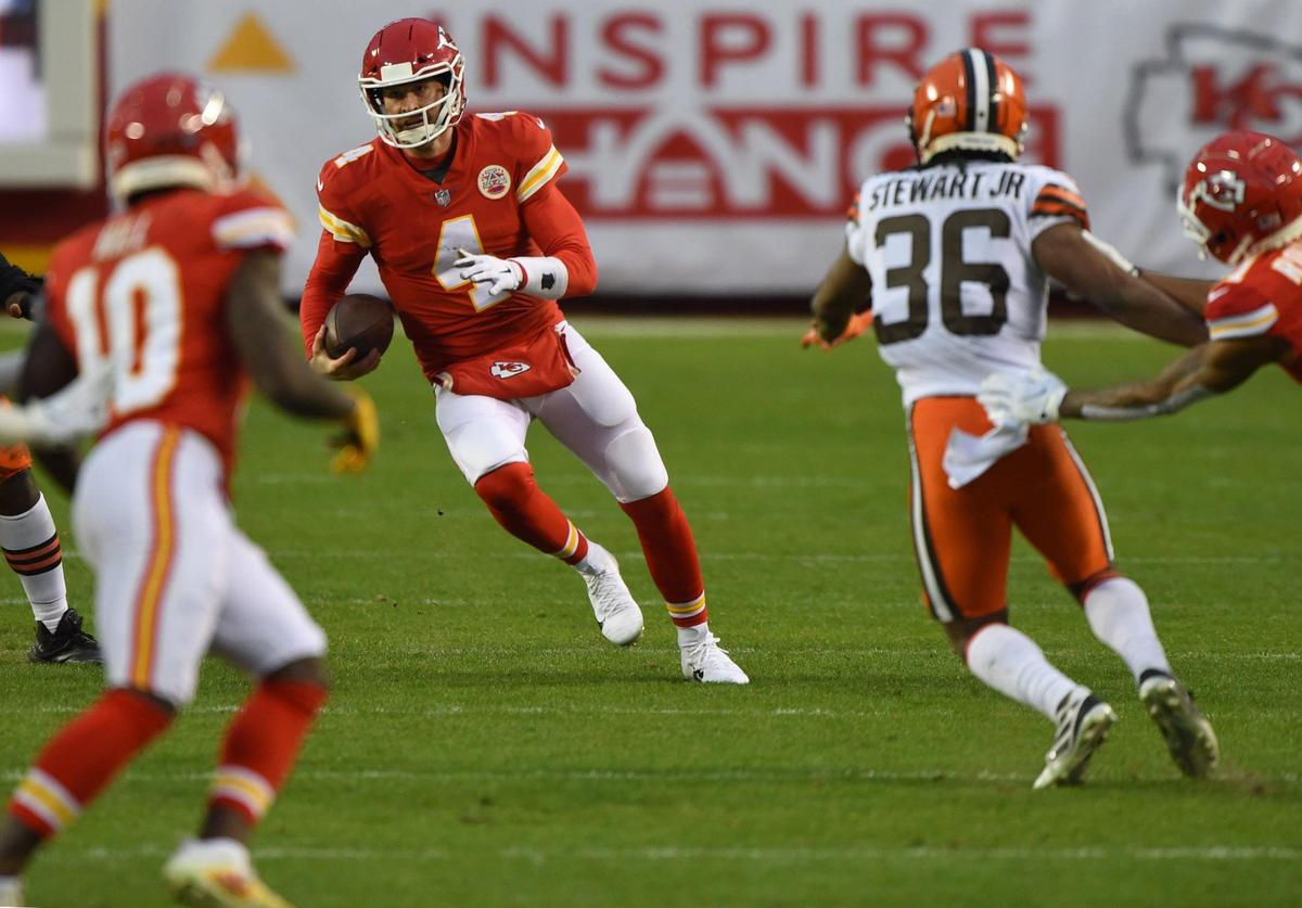 Kansas City Chiefs quarterback Chad Henne (4) scrambled for yardage in the fourth-quarter against the Cleveland Browns during AFC divisional playoff game Sunday, Jan. 17, 2021 at Arrowhead Stadium. The Chiefs held on to win, 22-17.