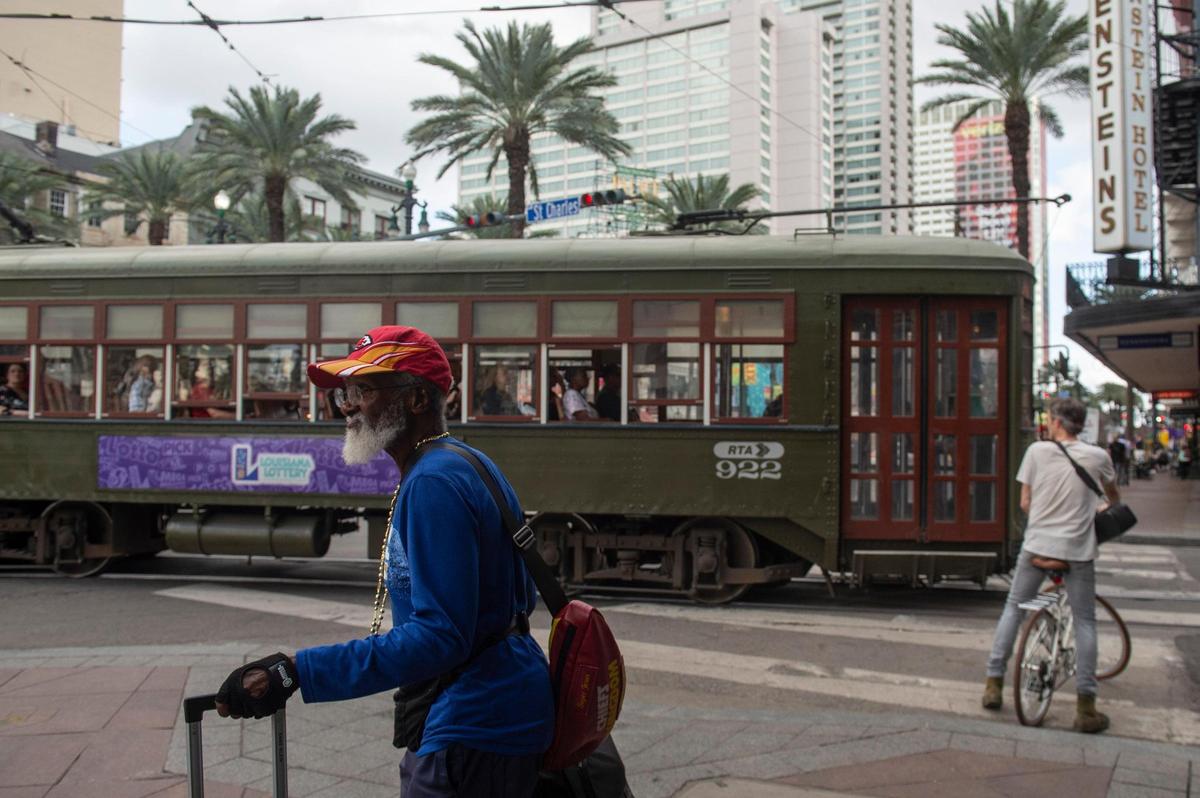 A Chiefs fan walks along Canal Street in New Orleans on Wednesday, Feb. 5, 2025.