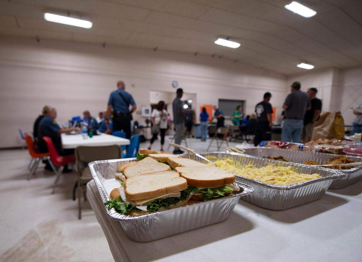 Food is set up for Amtrak train passengers and first responders at Northwestern R-1 School as people gather in the gymnasium after an Amtrak train derailed on Monday, June 27, 2022, near Mendon, Missouri.