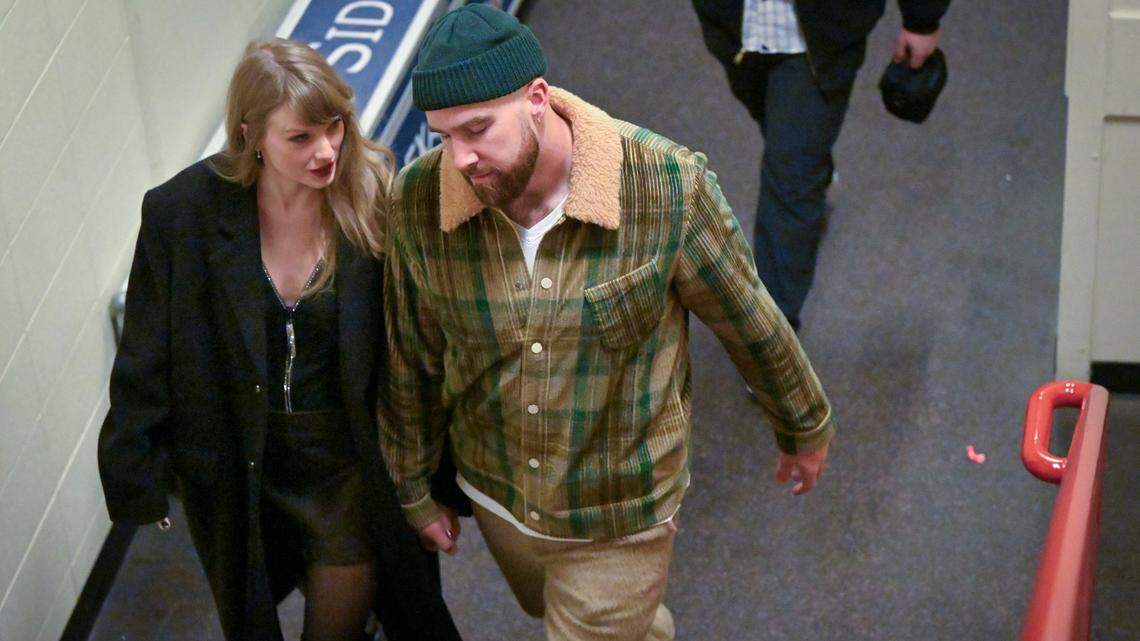 Taylor Swift and Travis Kelce talk as they leave after the Buffalo Bills defeated the Kansas City Chiefs, 20-17, on Sunday, Dec. 10, 2023, at GEHA Field at Arrowhead Stadium in Kansas City