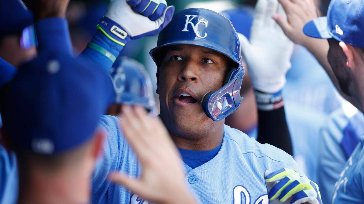 Kansas City Royals’ Salvador Perez celebrates in the dugout following his two-run home run during the first inning of a baseball game at Kauffman Stadium in Kansas City, Mo., Thursday, July 29, 2021. (AP Photo/Colin E. Braley)