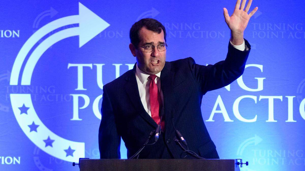 Kansas Attorney General Derek Schmidt acknowledges the crowd as he takes the the stage during the Turning Point Action “Unite and Win” rally held at the Olathe Conference Center, Embassy Suites.