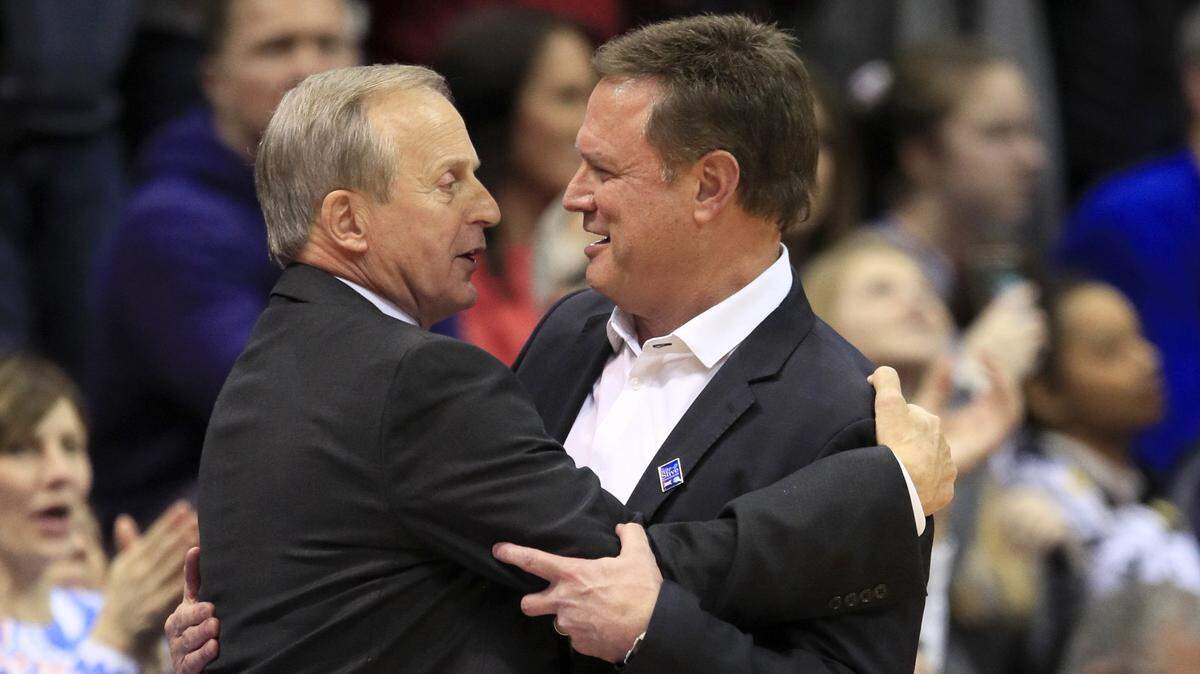 Tennessee head coach Rick Barnes, left, hugs Kansas head coach Bill Self, right, following an NCAA college basketball game in Lawrence, Kan., Saturday, Jan. 25, 2020. Kansas defeated Tennessee 74-68. (AP Photo/Orlin Wagner)