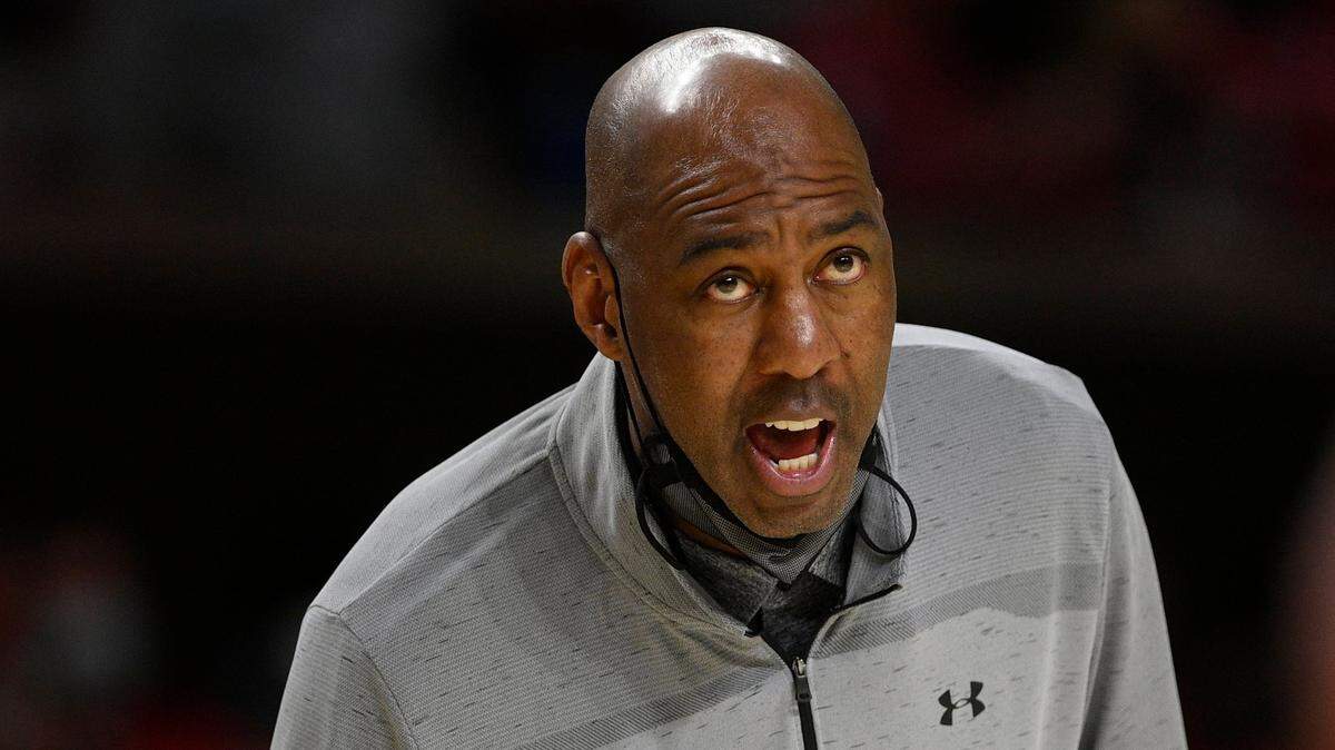 FILE - Maryland interim head coach Danny Manning reacts during the second half of an NCAA college basketball game against Iowa, Thursday, Feb. 10, 2022, in College Park, Md. Louisville head coach Kenny Payne has named former Kansas great and college basketball Hall of Famer Danny Manning as an assistant, a month after the coaching veteran completed an interim stint at Maryland.(AP Photo/Nick Wass, File)