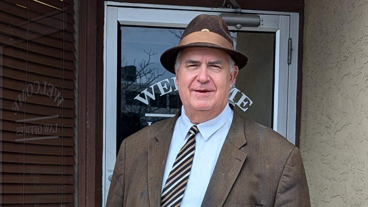 John Carnes outside his law office in Independence.