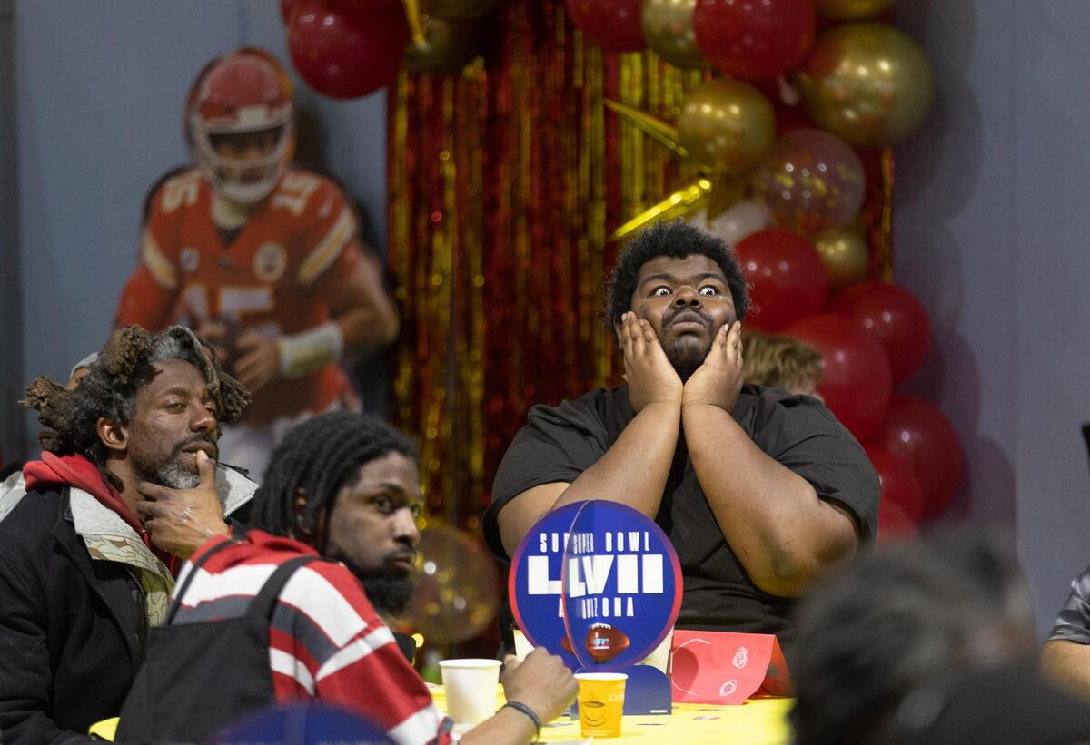 Aaron Hibler reacted to Philadelphia picking up a first down during a Super Bowl watch party for Kansas City’s homeless at the Cathedral of the Immaculate Conception on Sunday.