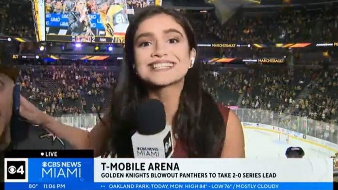 Reporter deftly shoves unruly fan away from live shot during Stanley Cup game Monday