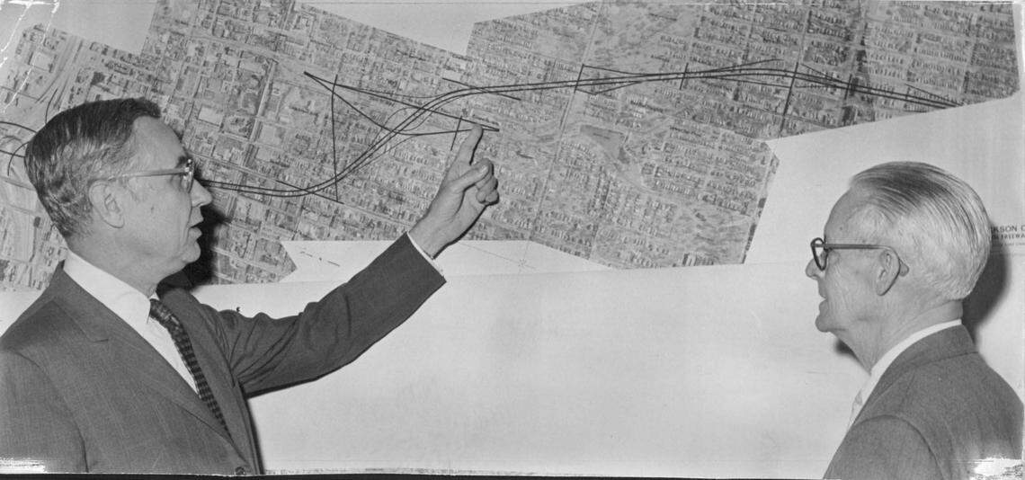 Ilus W. Davis (left), Kansas City mayor from 1963 to 1971, discusses the South Midtown Freeway with a Missouri highway official.