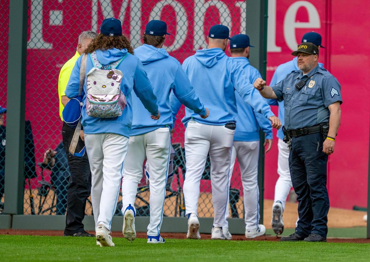 Kansas City Royals pitcher Andrew Hoffmann (54) carries a Hello Kitty backpack to the bullpen before the start of the game against the Detroit Tigers on Friday, May 30, 2025, at Kauffman Stadium in Kansas City.
