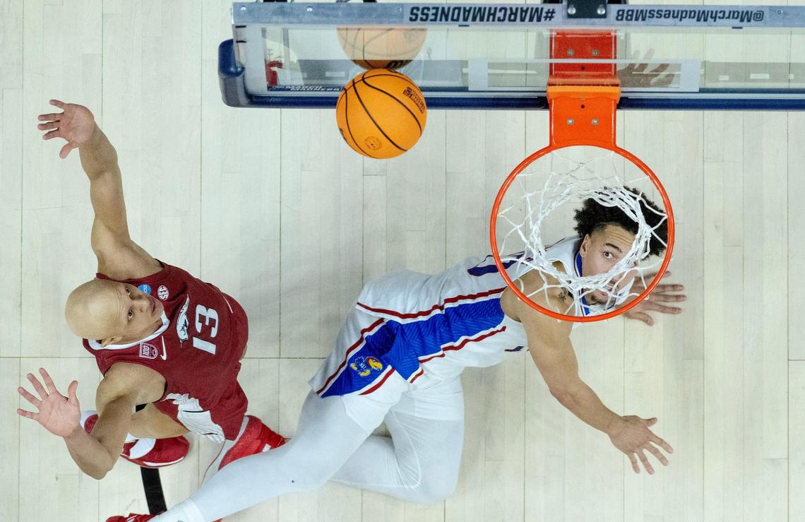 Kansas forward Jalen Wilson (10) watches his shot bounce off the glass as Arkansas guard Jordan Walsh (13) looks on during a second-round college basketball game in the NCAA Tournament Saturday, March 18, 2023, in Des Moines, Iowa.