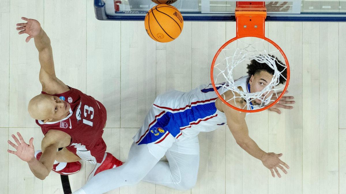 Kansas forward Jalen Wilson (10) watches his shot bounce off the glass as Arkansas guard Jordan Walsh (13) looks on during a second-round college basketball game in the NCAA Tournament Saturday, March 18, 2023, in Des Moines, Iowa.