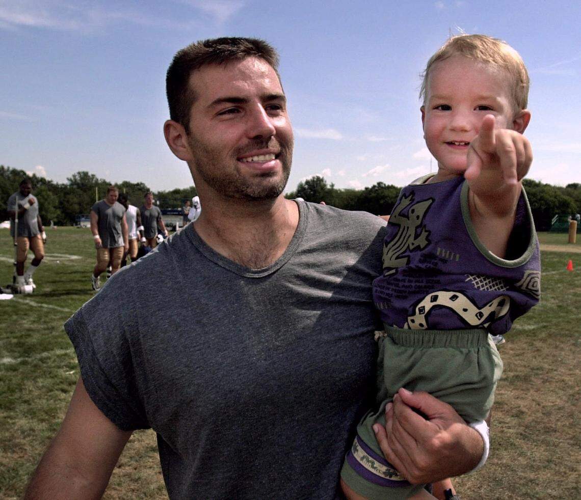 That lad on the right, Kade Warner, is going to play in a bowl for the first time with his teammates at Kansas State. Here, in July 2000, his dad (and future Hall of Famer) Kurt Warner carries him off the field after a training camp practice with the St. Louis Rams.