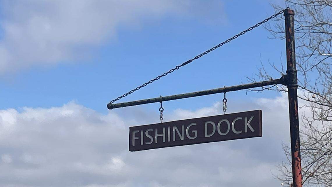 A sign pointing to the fishing docks is posted at the marina of Wyandotte County Lake Park on the afternoon of March 5, 2026.