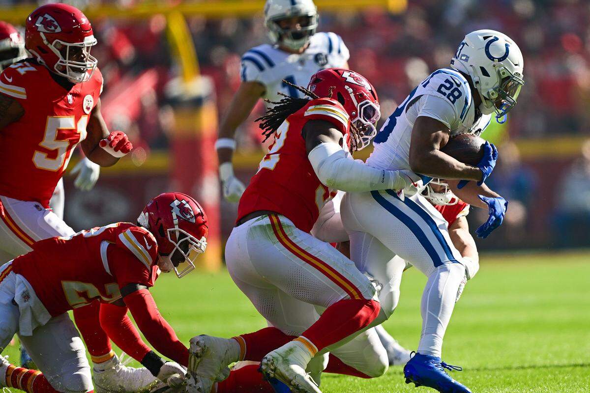 Kansas City Chiefs linebacker Nick Bolton tackles Indianapolis Colts running back Jonathan Taylor (28) on Sunday, Nov. 23, 2025, at GEHA Field at Arrowhead Stadium on