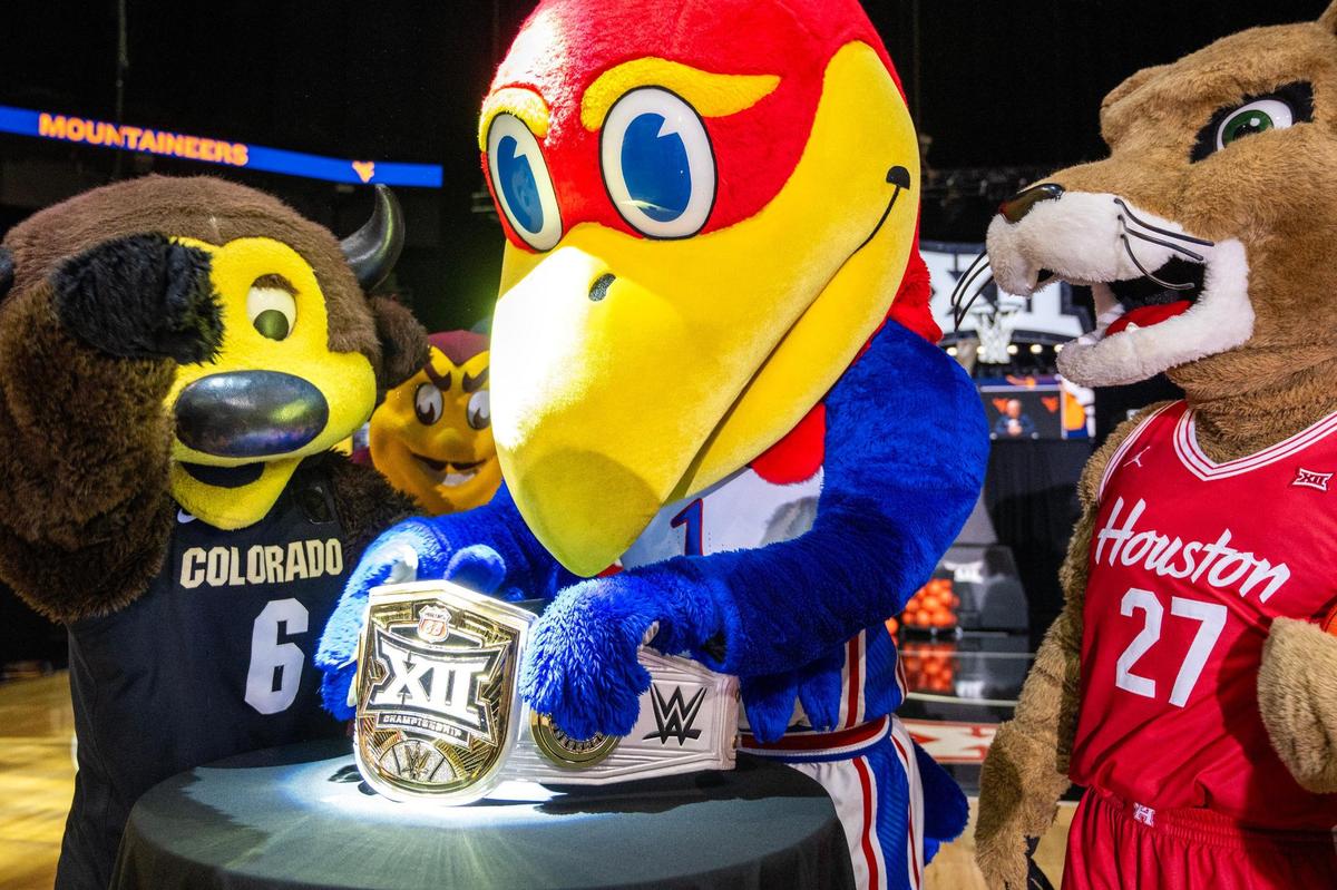 The University of Kansas mascot, Big Jay, adjusts his Big 12 championship belt during Big 12 Media Day at T-Mobile Center on Oct. 22, 2024, in Kansas City.