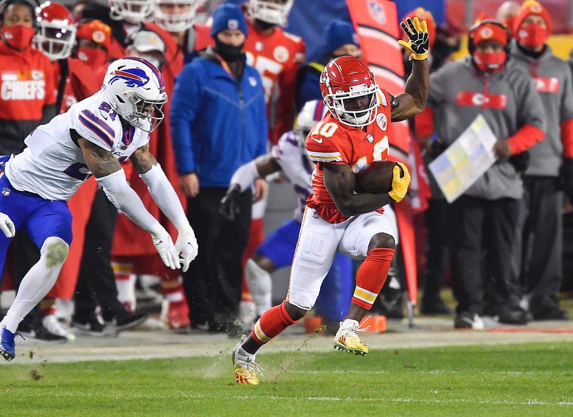 Kansas City Chiefs wide receiver Tyreek Hill scrambles for yardage in the second half Sunday, January 24, 2021, during the AFC Championship Game at Arrowhead Stadium in Kansas City, Missouri.