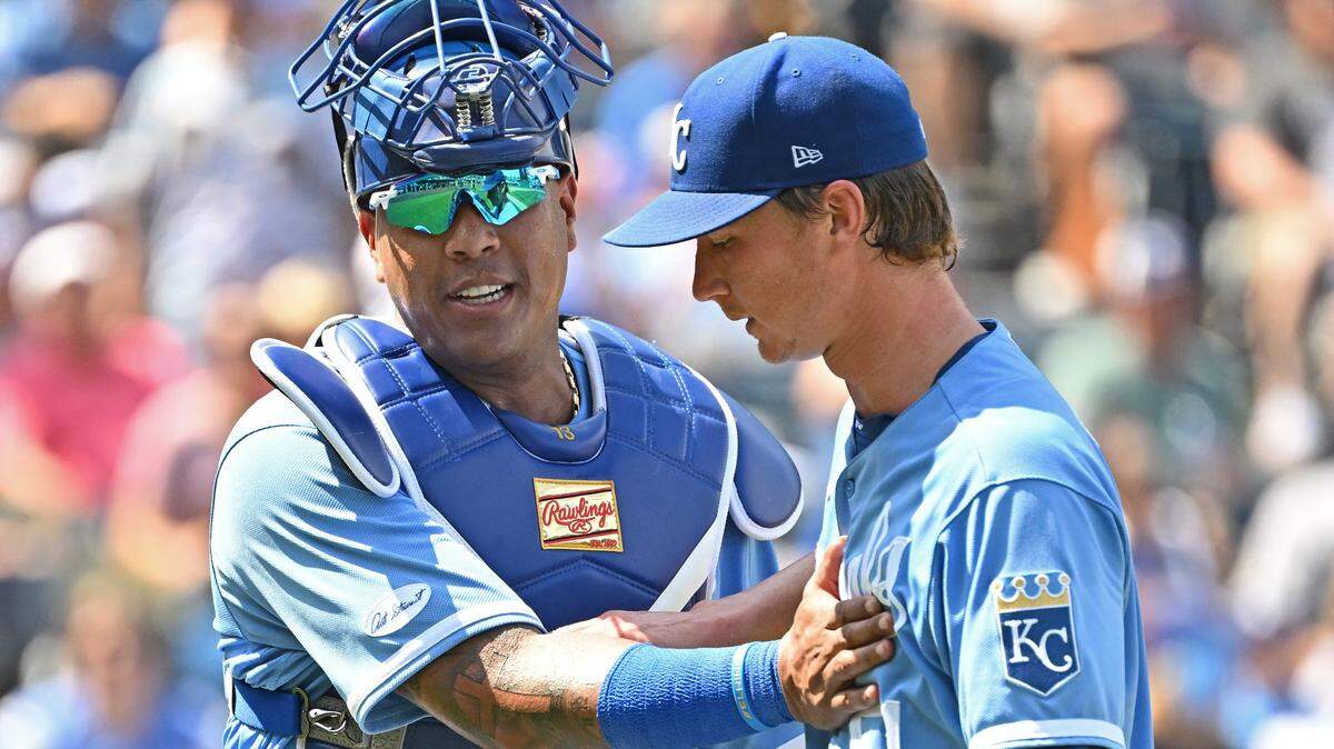 Kansas City Royals catcher Salvador Perez (13) congratulates starting pitcher Brady Singer (51) after the sixth inning against the Los Angeles Dodgers at Kauffman Stadium on Aug. 14, 2022.