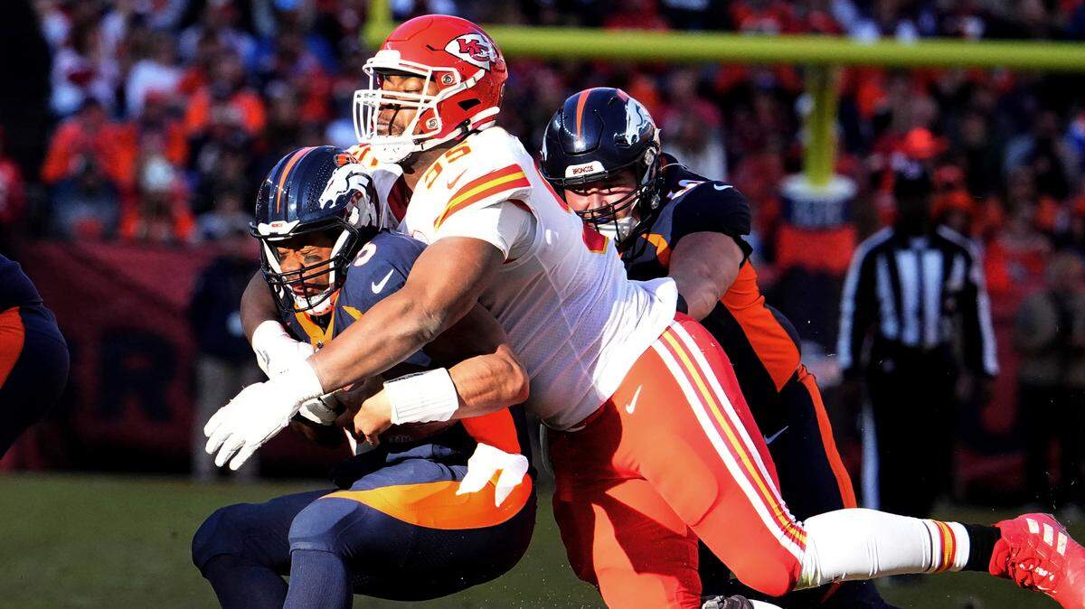 Kansas City Chiefs defensive tackle Chris Jones (95) sacks Denver Broncos quarterback Russell Wilson (3) of an NFL football game Sun/v95day, December 11, 2022, in Denver.