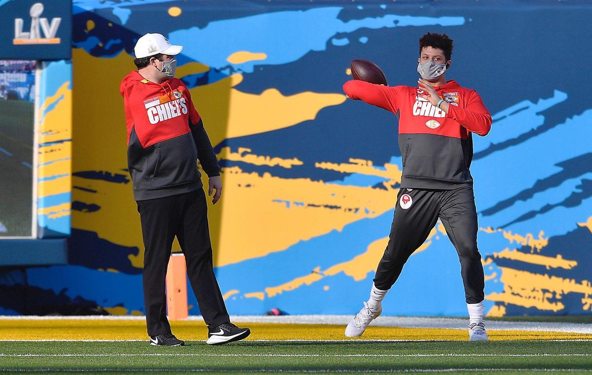Kansas City Chiefs quarterback Patrick Mahomes warms up on the field Sunday, February 7, 2021, before the start of Super Bowl LV at Raymond James Stadium in Tampa, Florida.