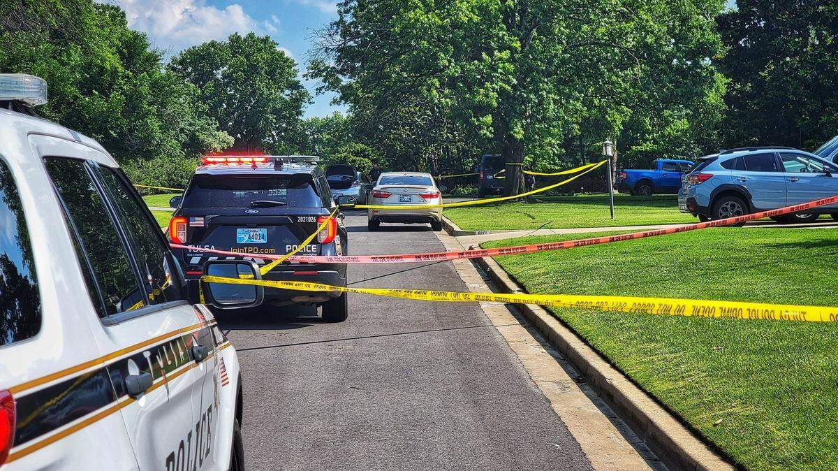 A man opened fire on a group trying to help a jogger shot in the leg, Oklahoma police said. He was shot and killed by officers.