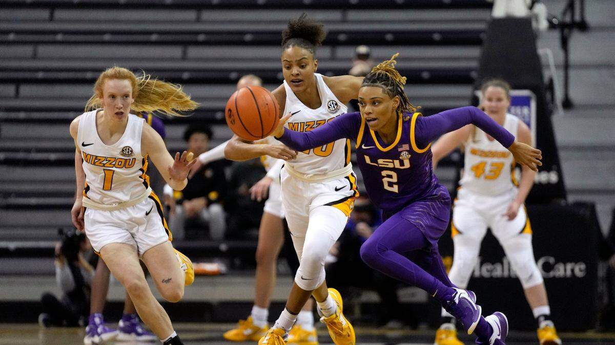 LSU’s Jasmine Carson (No. 2) chases a loose ball with Missouri’s Katlyn Gilbert and Lauren Hansen in pursuit during Wednesday evening’s game in Columbia, Mo.