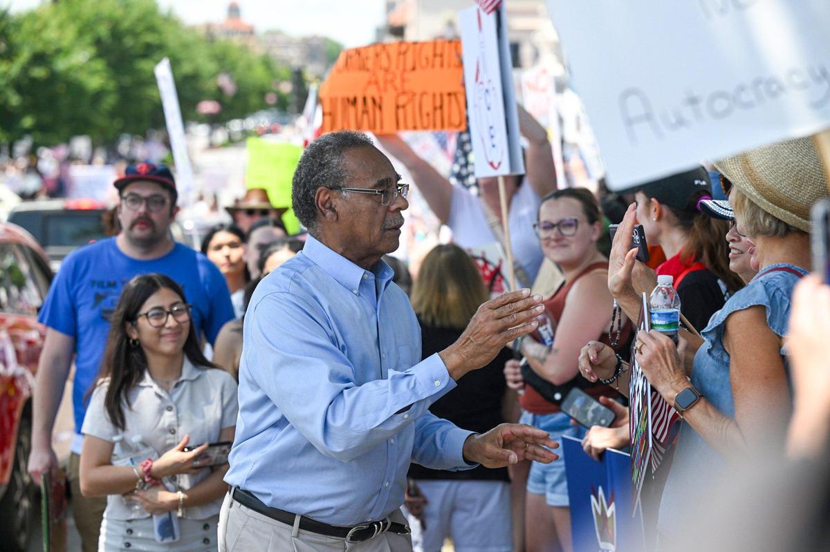 Cleaver greeted demonstrators during the “No Kings” rally last summer in Mill Creek Park.