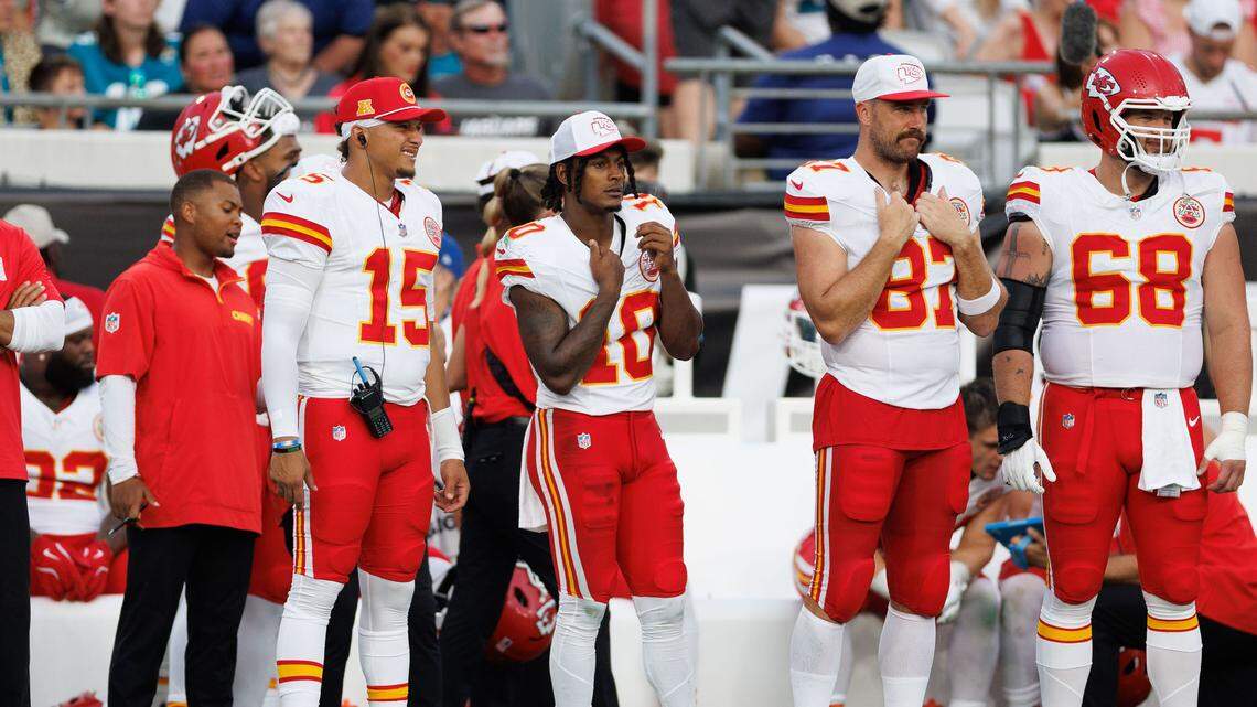 Kansas City Chiefs quarterback Patrick Mahomes (15), running back Isiah Pacheco (10), and tight end Travis Kelce (87) look on during the first quarter against the Jacksonville Jaguars at EverBank Stadium on Aug. 10, 2024.