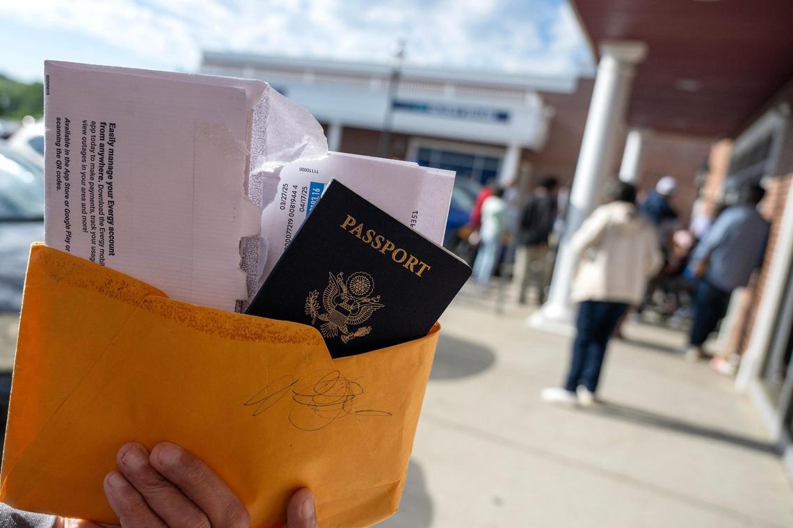 David Arciga holds his paperwork while waiting in line outside the Kansas City DMV the moring of Wednesday, May 7, in Kansas City. Arciga was applying for a Real ID and said he had already been waiting for an hour and a half.