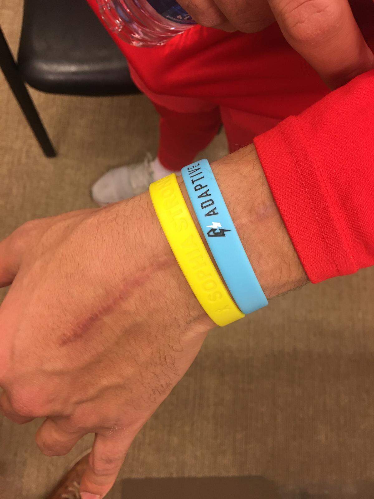 On his left wrist, Chiefs quarterback Patrick Mahomes wears wristbands honoring Sophia Linenberger and the Adaptive Foundation.