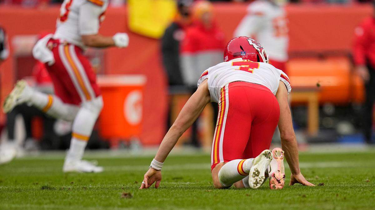 Kansas City Chiefs kicker Harrison Butker (7) gets off the ground after slipping on a kickoff against the Denver Broncos during the first half of an NFL football game Saturday, Jan. 8, 2022, in Denver. (AP Photo/Jack Dempsey)