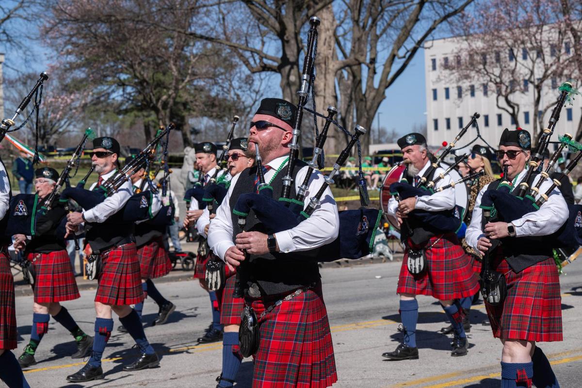 Men in kilts playing bagpipes march in the Kansas City St. Patrick’s Day Parade on Monday, March 17, 2025.