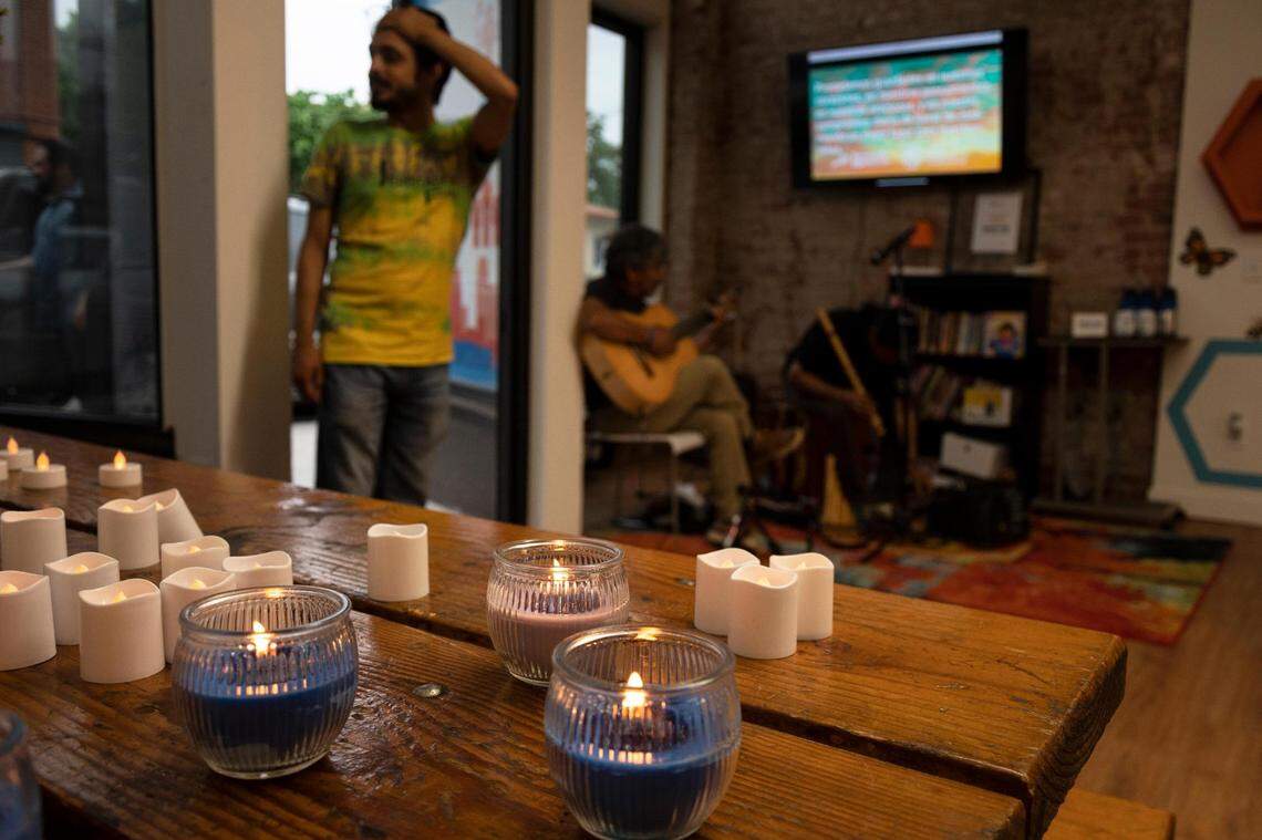 Candles flicker at the Latinx Education Collaborative for the “Vigilia para nuestros niños” (Vigil for Our Children), in Kansas City on May 31, 2022.