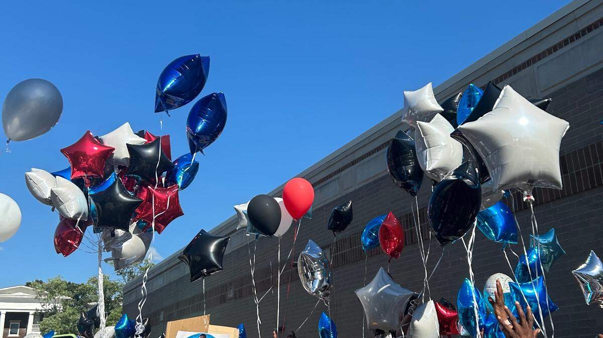 Mourners release balloons at a vigil in honor of Deshaun McKinzy, 29, who was fatally shot in a Walgreens parking lot at Broadway Boulevard and 39th Street on June 16.