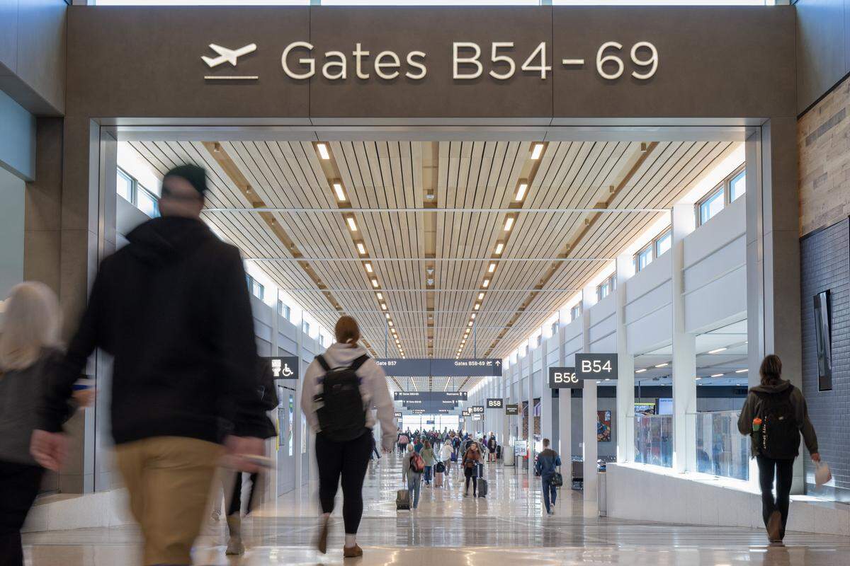 Travelers make their way to the boarding gates at Kansas City International Airport on Wednesday, Feb. 28, 2024, in Kansas City.