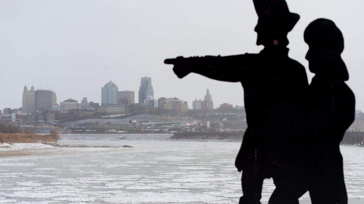 A silhouette statue of Lewis and Clark is seen at the confluence of the icy Kansas and Missouri Rivers on Thursday, Dec. 22, 2022, in Kansas City, Kan.