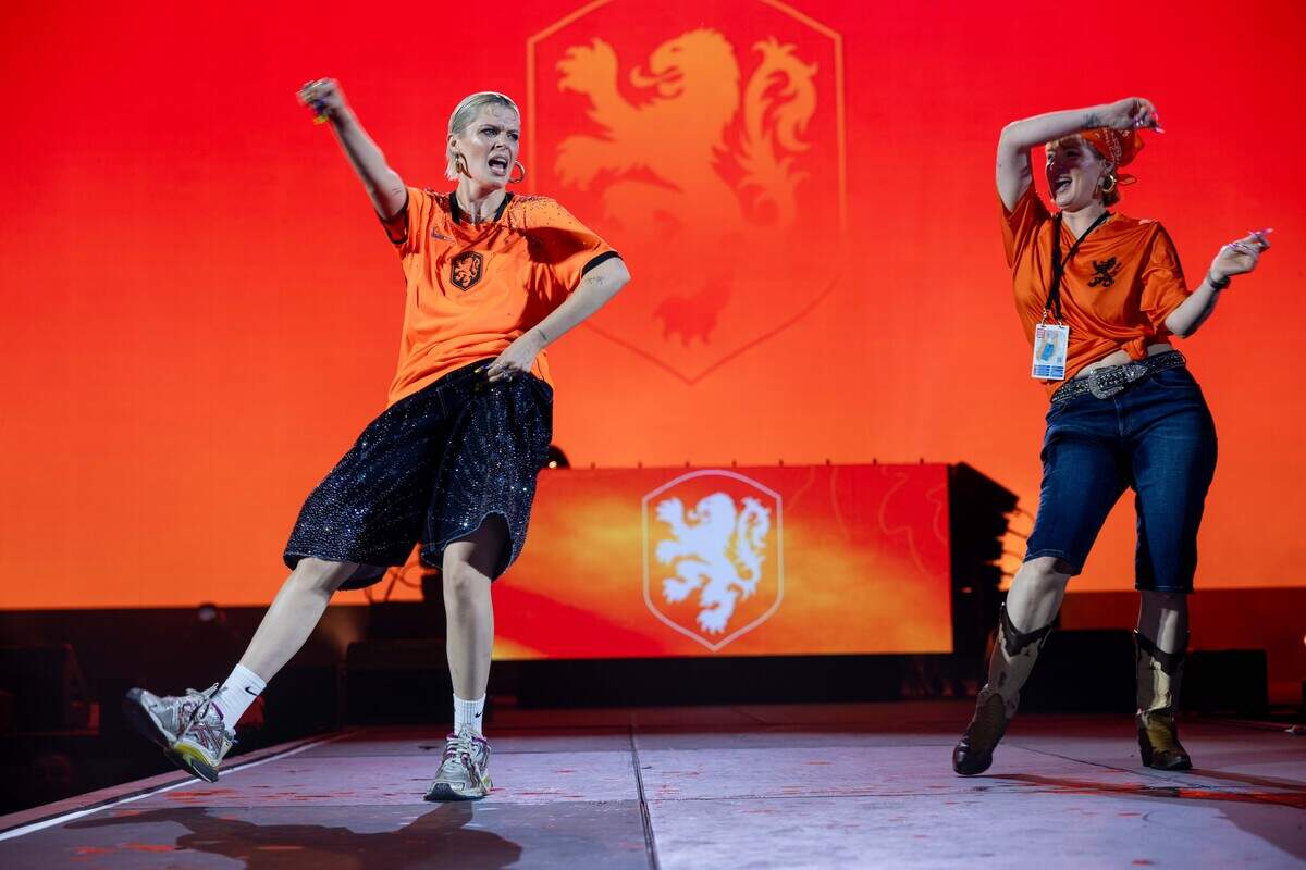 Dutch fans wave their flags and cheer as they celebrate their team during the Bij Oranje Party at Fan Fest on Wednesday, June 24, 2026.