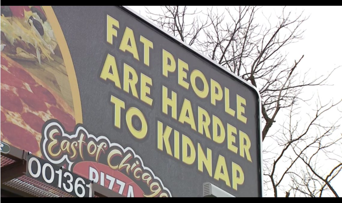 A pizza shop in Ohio removed a billboard after receiving a complaint that it was insensitive, the owner says.