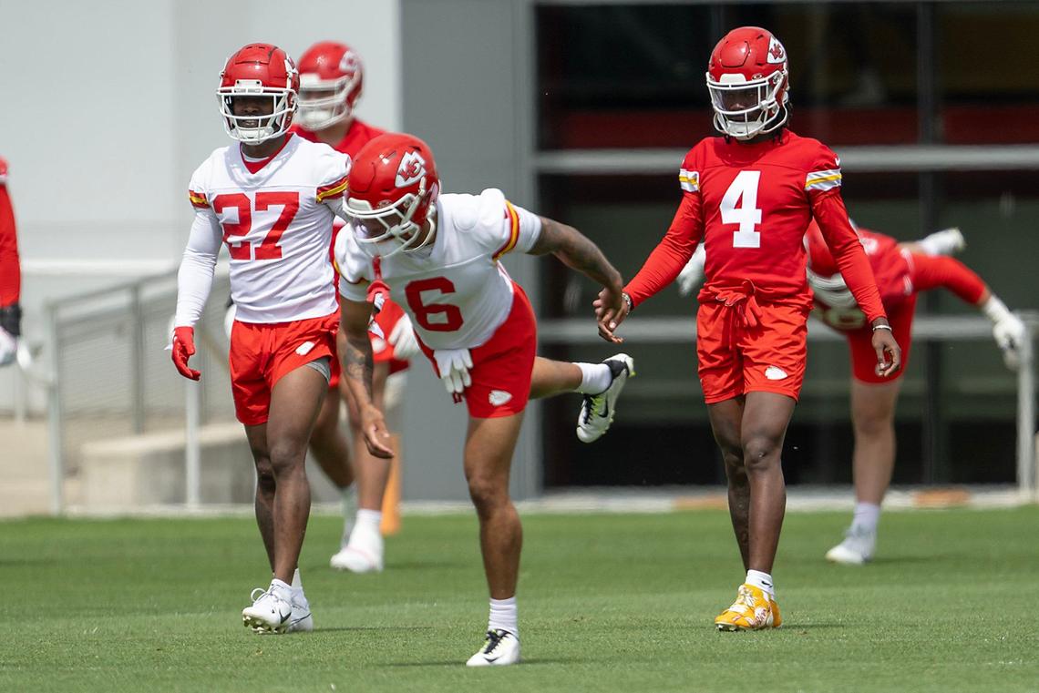 Chiefs defensive back Chamarri Connor (27), safety Bryan Cook (6) and wide receiver Rashee Rice (4) stretch during OTA’s at the Chiefs training facility on Wednesday, May 22, 2024, in Kansas City.