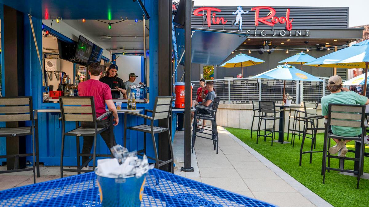 Tin Roof provides picnic tables and a patio seating area outside.