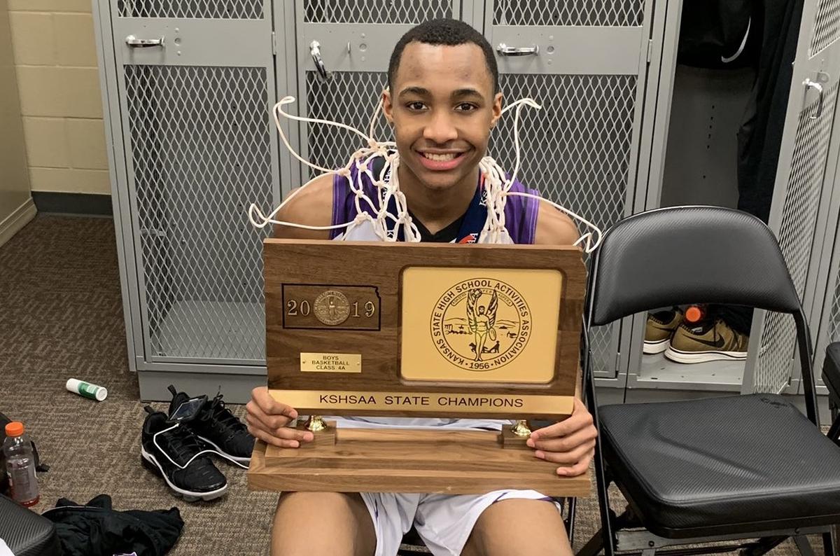 Tamar Bates of Piper High with last year’s state title trophy.