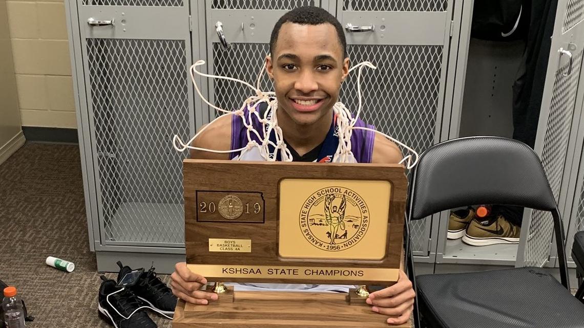 Tamar Bates of Piper High, holding the 2019 state title trophy, has not been able to play AAU basketball yet during the spring/summer season because of the pandemic. The NCAA on Wednesday extended the recruiting dead period to July 31.
