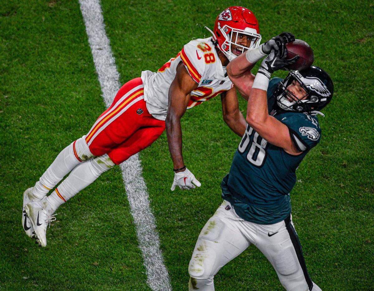 Kansas City Chiefs cornerback L’Jarius Sneed couldn’t keep Philadelphia Eagles punter Arryn Siposs from catching a pass pinned against his helmet during Super Bowl LVII Sunday, Feb. 12, 2023, in Glendale, Ariz.