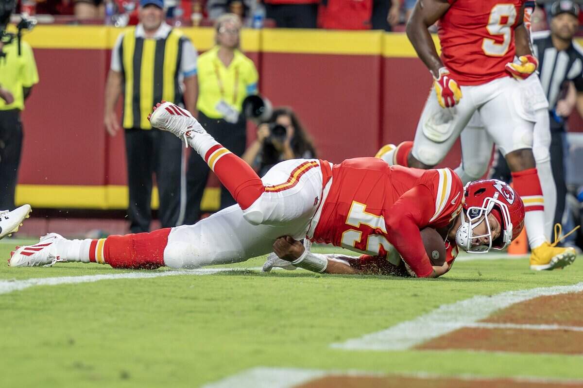 Kansas City Chiefs quarterback Patrick Mahomes (15) dives to make a touchdown in the first quarter during the season opener against the Denver Broncos at Arrowhead Stadium on Monday, Sept. 14, 2026, in Kansas City.