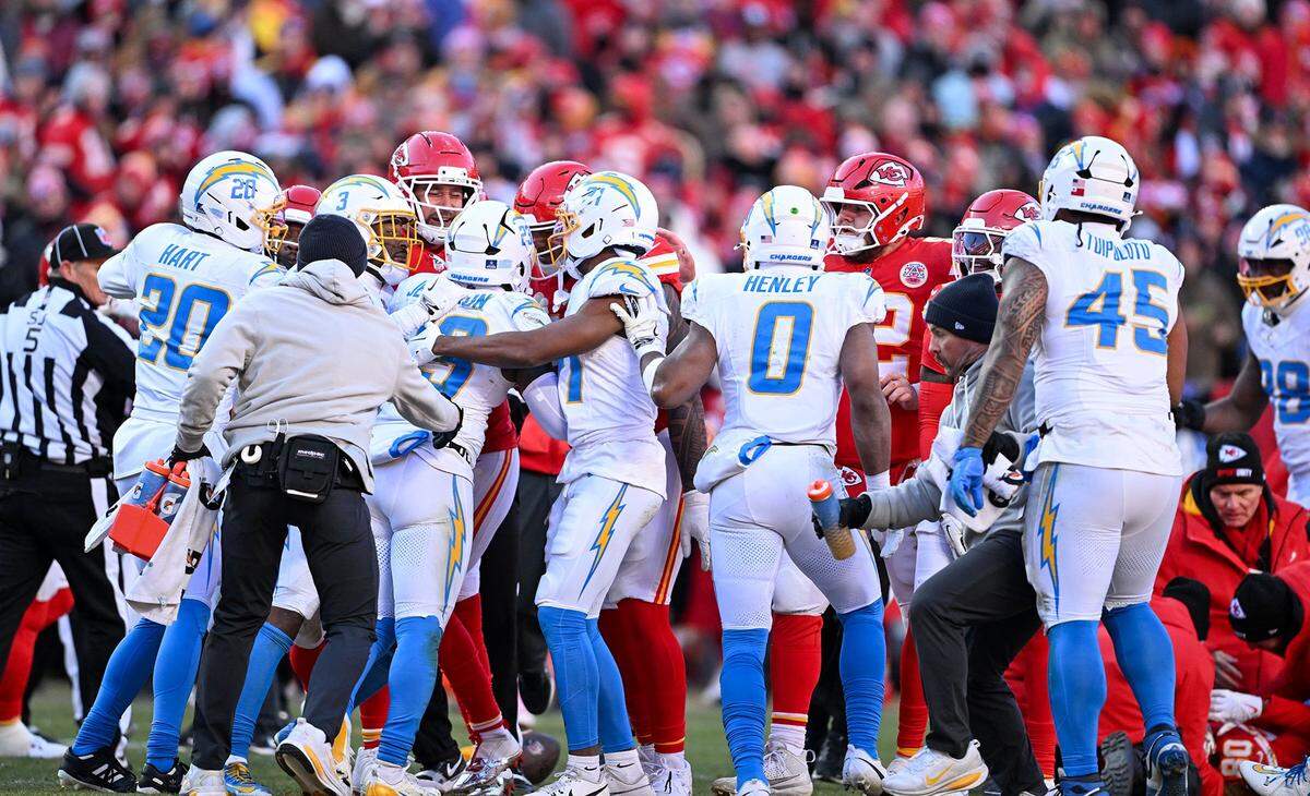 A skirmish breaks out in between Kansas City Chiefs and Los Angeles Chargers players after a helmet-to-helmet hit on Kansas City Chiefs wide receiver Tyquan Thornton (80) from Los Angeles Chargers safety Tony Jefferson (23) in the second half at GEHA Field at Arrowhead Stadium on Sunday, Dec. 14, 2025.