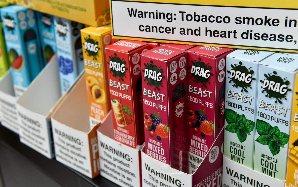 Except for part of one wall, the entire cashier’s booth at the south Kansas City convenience store FavTrip is lined with flavored tobacco products. 