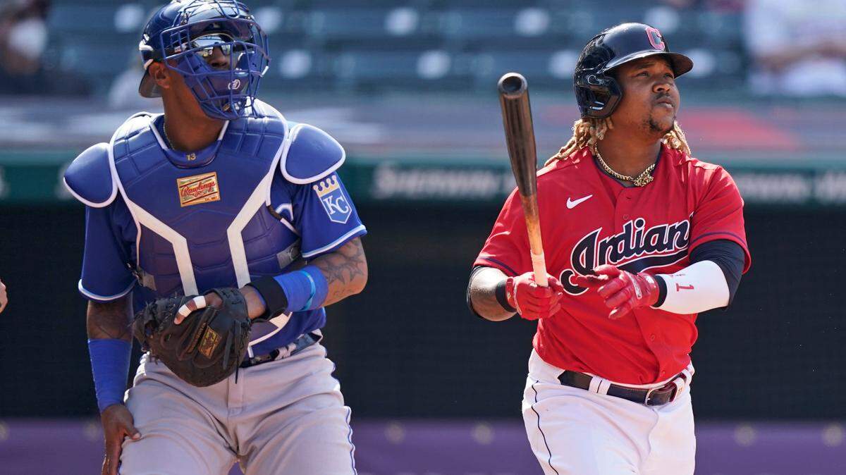 Cleveland Indians’ Jose Ramirez, right, watches his ball along with Kansas City Royals catcher Salvador Perez after Ramirez hit a two-run home run in the eighth inning of a baseball game, Wednesday, April 7, 2021, in Cleveland. The Indians won 4-2. (AP Photo/Tony Dejak)