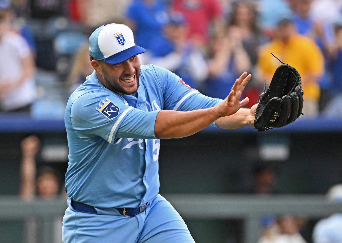 Kansas City Royals relief pitcher Carlos Estevez (53) celebrated with a Kamehameha after striking out the final Cleveland Guardians batter for the win at Kauffman Stadium.